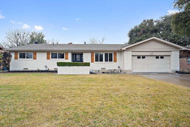 single story home featuring a garage and a front lawn