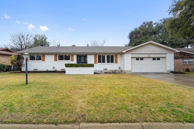 single story home featuring a garage and a front yard