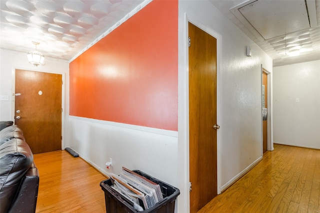 hall with light hardwood / wood-style flooring