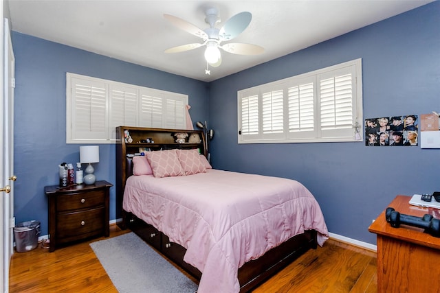 bedroom with hardwood / wood-style flooring and ceiling fan