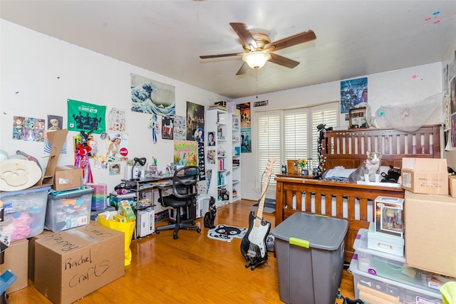 bedroom with hardwood / wood-style floors