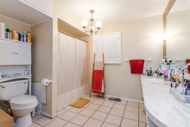 full bathroom featuring a notable chandelier, vanity, tile patterned floors, and toilet