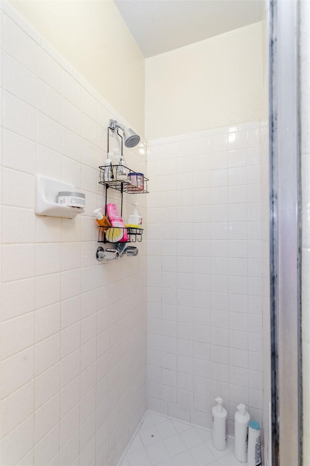 bathroom with tiled shower