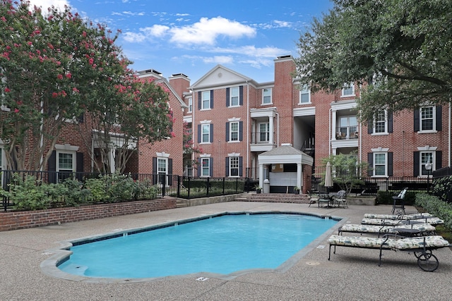 view of pool featuring a patio area