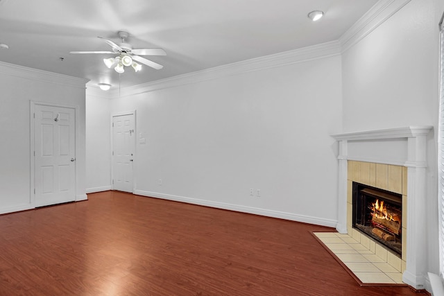 unfurnished living room featuring ceiling fan, crown molding, a fireplace, and wood-type flooring