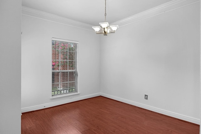 unfurnished room featuring crown molding, a healthy amount of sunlight, dark wood-type flooring, and an inviting chandelier