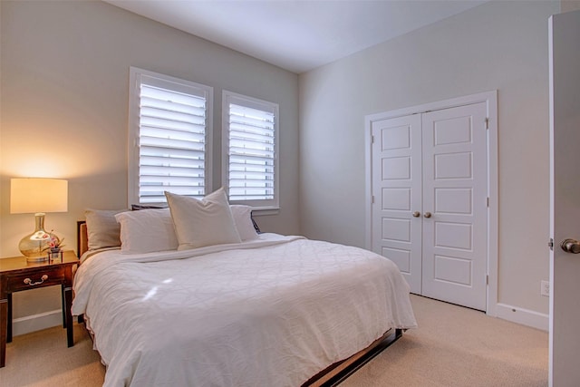 carpeted bedroom featuring a closet