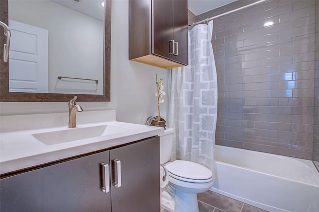 full bathroom featuring tile patterned floors, toilet, vanity, and shower / bath combo