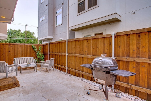 view of patio / terrace featuring a grill and an outdoor hangout area