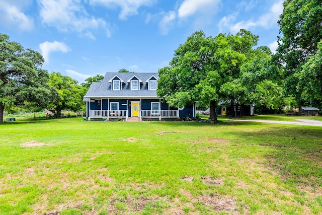 cape cod home with a porch and a front lawn