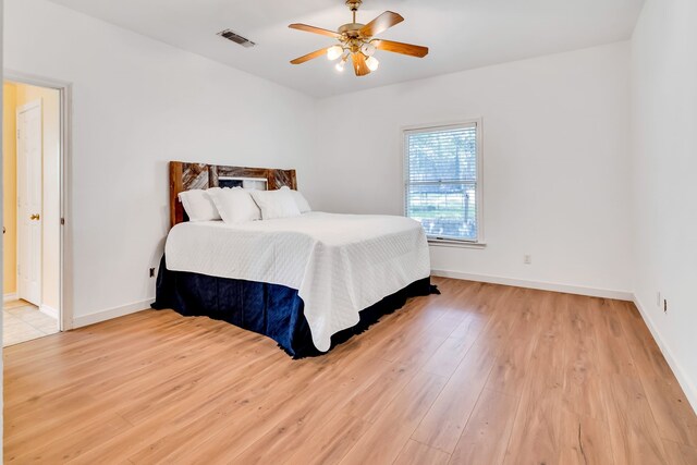 living room with hardwood / wood-style flooring, plenty of natural light, french doors, and ceiling fan