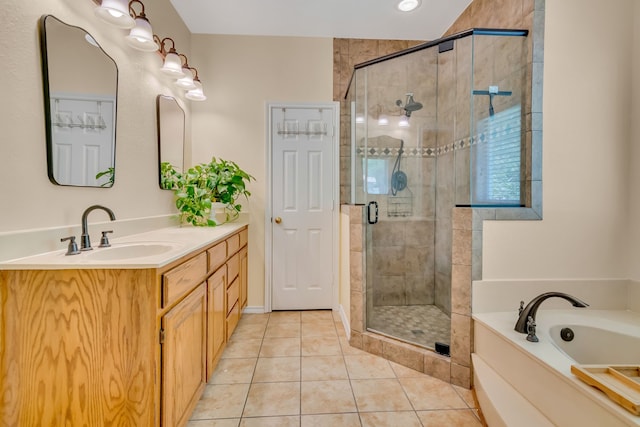 bathroom featuring tile patterned flooring, vanity, and independent shower and bath