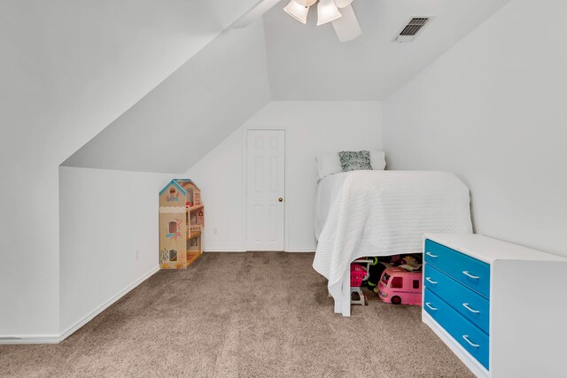 carpeted bedroom featuring vaulted ceiling and ceiling fan