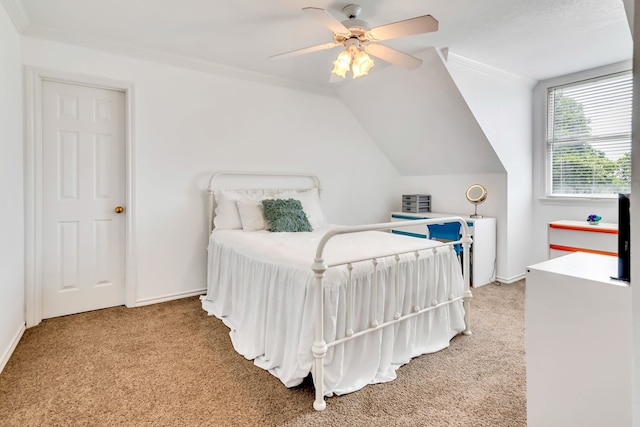 carpeted bedroom with crown molding, ceiling fan, and lofted ceiling