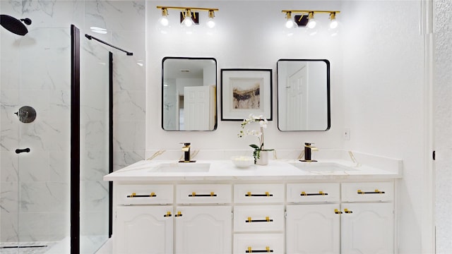 bathroom featuring a tile shower and vanity