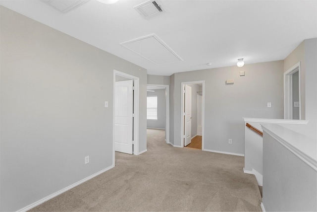 unfurnished room with light colored carpet