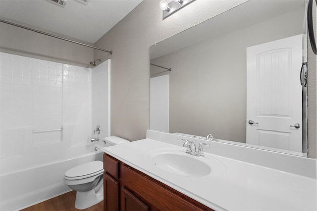 full bathroom featuring vanity, tub / shower combination, hardwood / wood-style floors, and toilet