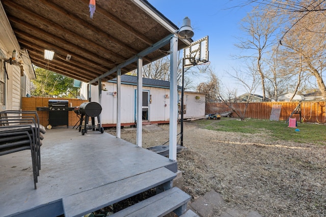 view of patio featuring a grill