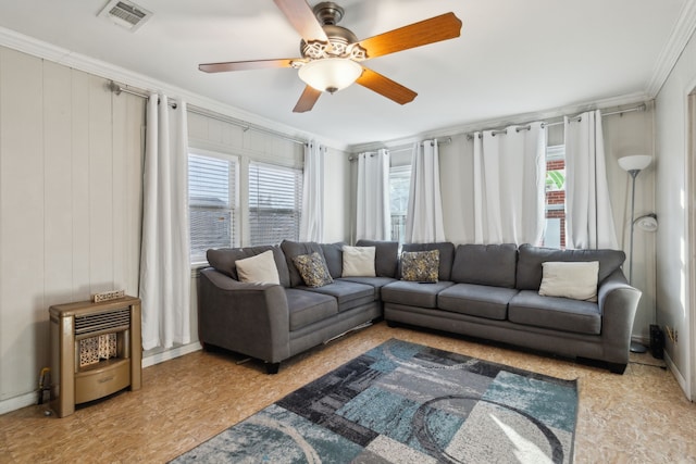 living room featuring ornamental molding and ceiling fan