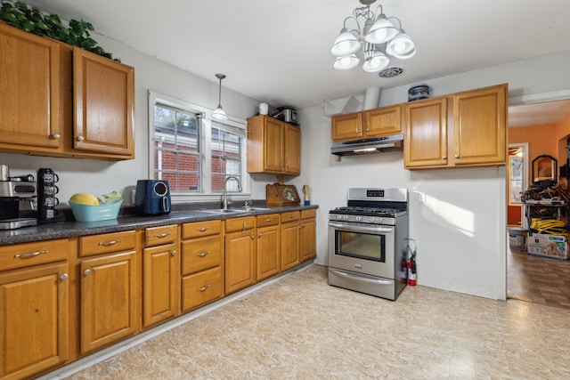 kitchen with pendant lighting, an inviting chandelier, sink, and gas stove