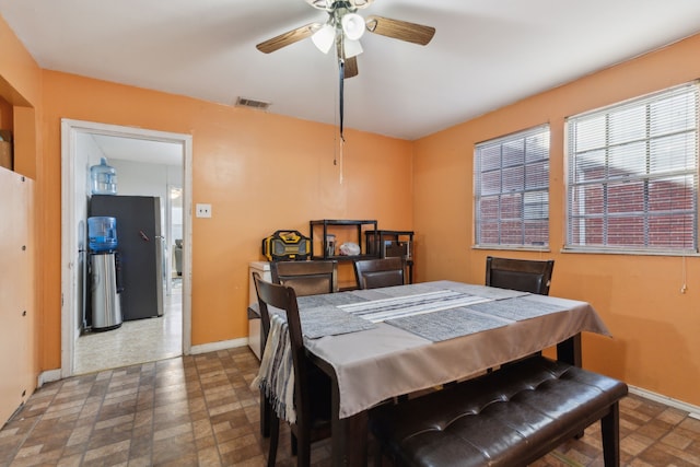 dining space featuring ceiling fan