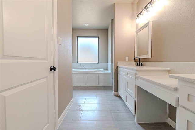 bathroom with a bathing tub and vanity