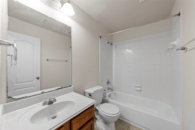 full bathroom with tiled shower / bath, vanity, toilet, and tile patterned flooring