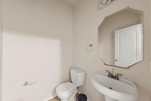 bathroom with sink and toilet