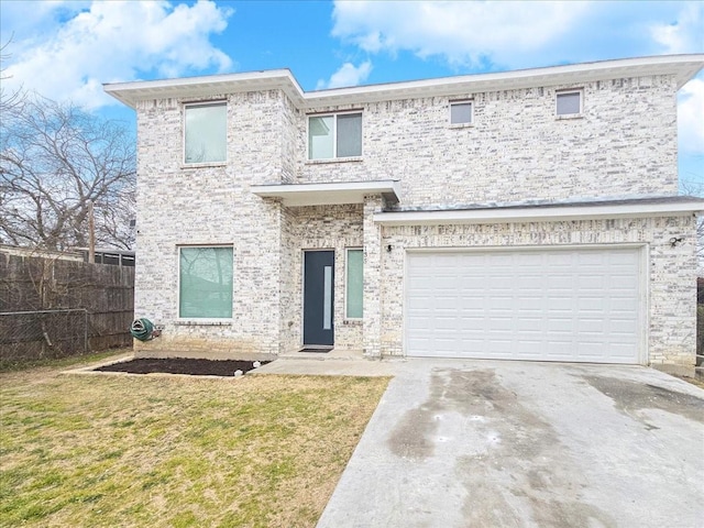 view of front of home with a garage and a front yard