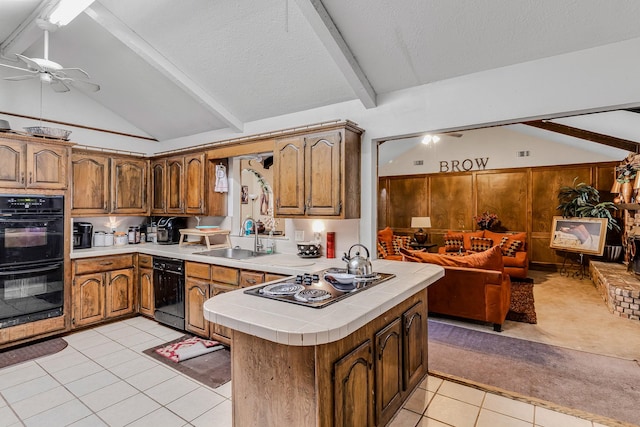 kitchen with vaulted ceiling with beams, kitchen peninsula, and black appliances