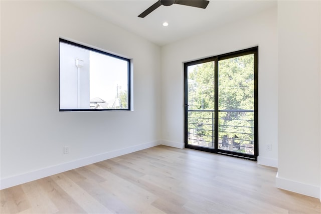 unfurnished room with ceiling fan, a healthy amount of sunlight, and light hardwood / wood-style floors