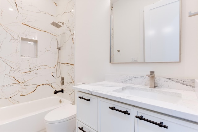 full bathroom with tiled shower / bath combo, vanity, and toilet