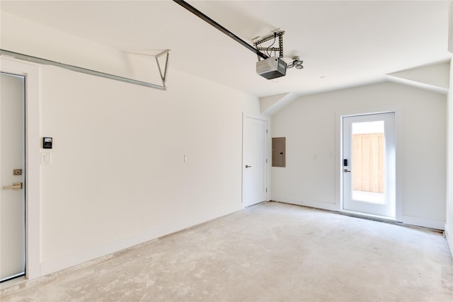 garage featuring a garage door opener and electric panel