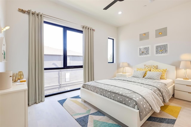 bedroom featuring light hardwood / wood-style flooring and ceiling fan