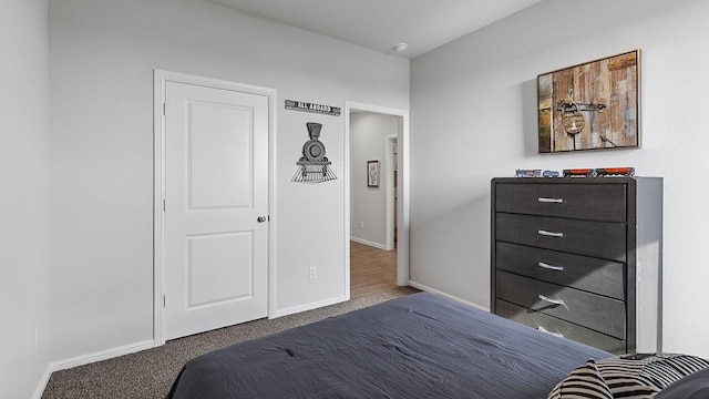 bedroom with dark colored carpet