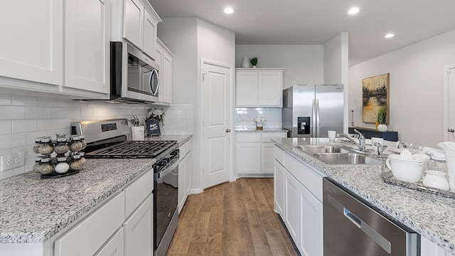 kitchen featuring sink, stainless steel appliances, and white cabinets