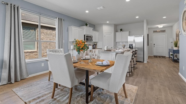 dining room featuring light wood-type flooring