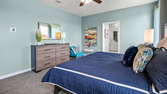 bedroom with connected bathroom, ceiling fan, and carpet flooring