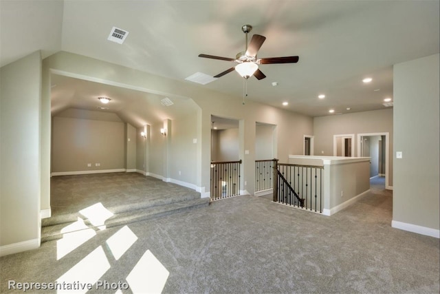 carpeted empty room featuring ceiling fan