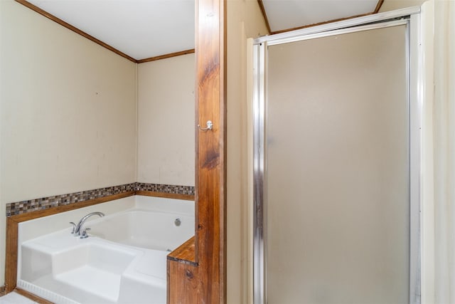 bathroom with independent shower and bath and crown molding