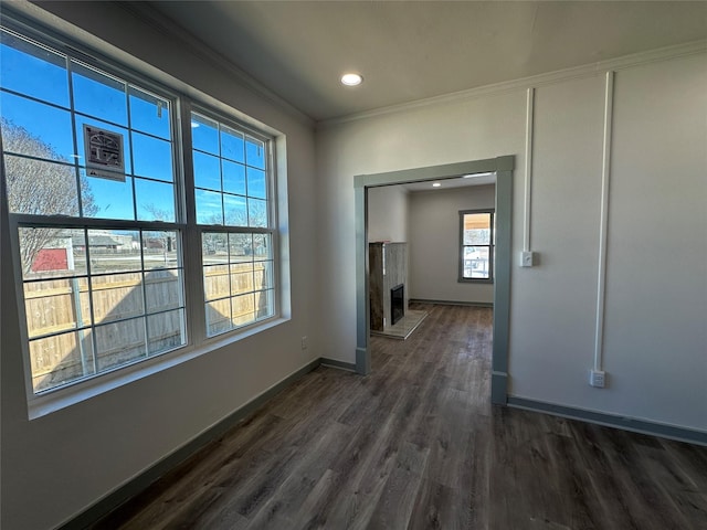 hallway featuring dark hardwood / wood-style flooring and ornamental molding