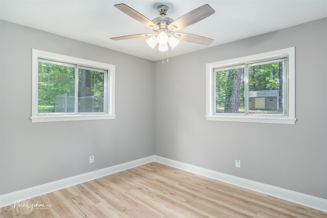 spare room featuring ceiling fan and light wood-type flooring