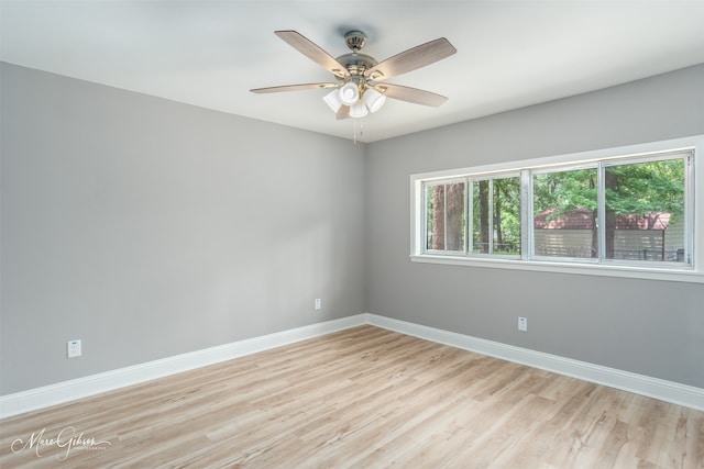 empty room featuring ceiling fan and light hardwood / wood-style flooring