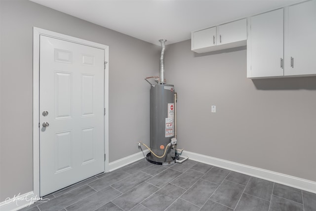 utility room featuring water heater