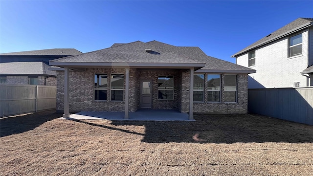 rear view of property featuring a patio area