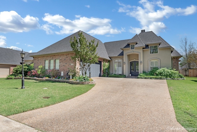 french country inspired facade with a garage and a front lawn