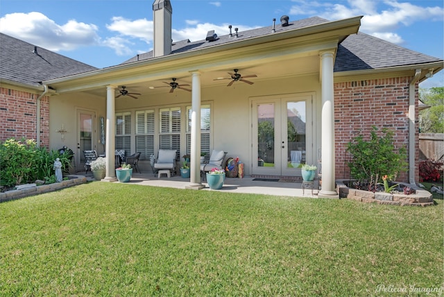 back of property featuring a lawn, a patio area, ceiling fan, and french doors