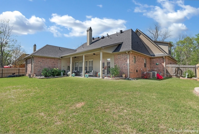 back of house with central AC unit, a yard, a patio, and ceiling fan