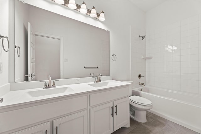 full bathroom with tiled shower / bath combo, vanity, and toilet