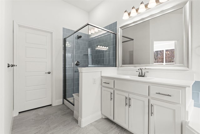 bathroom with vanity and an enclosed shower